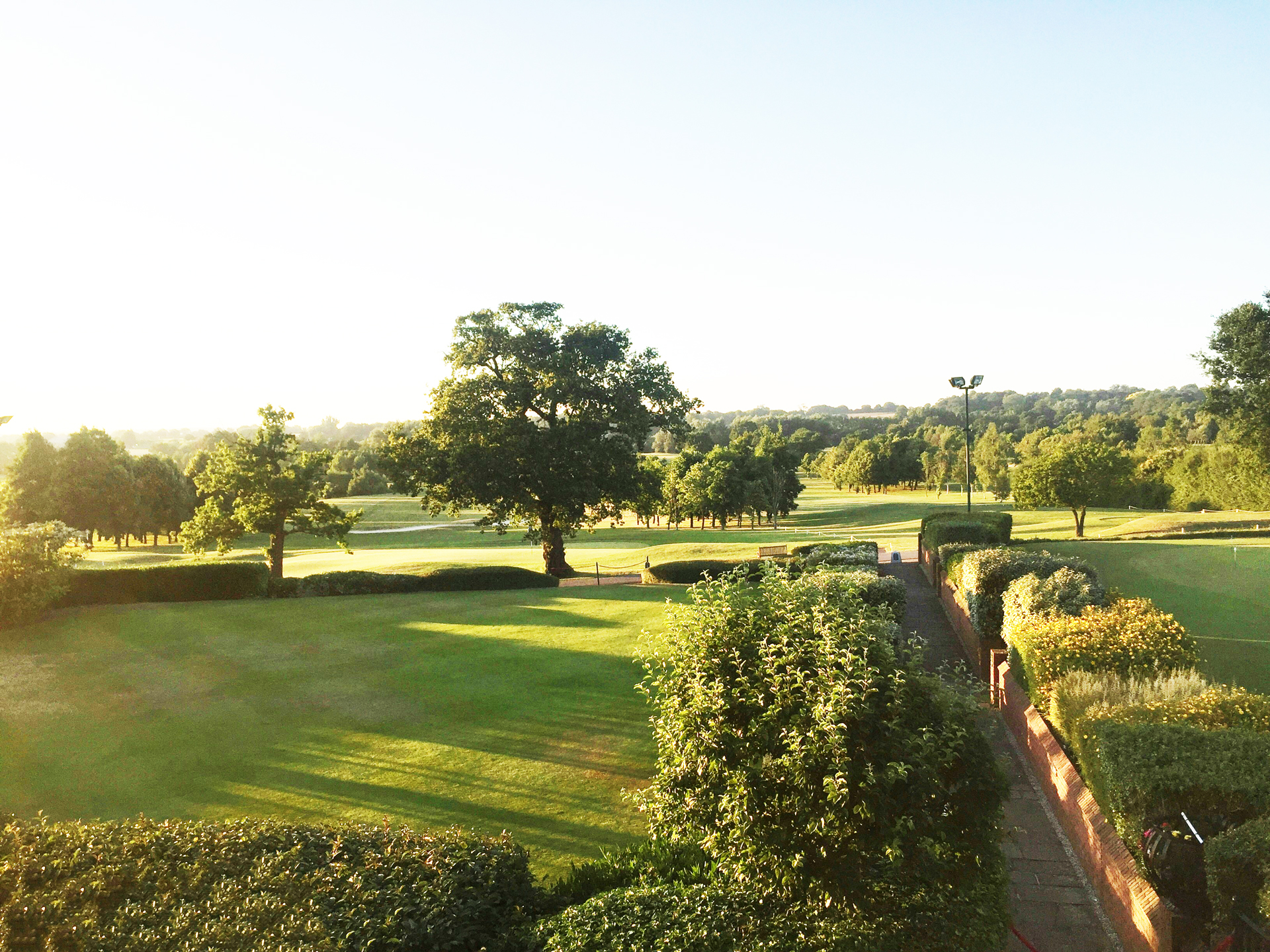 josie-jean-SMpk2Khag6E-unsplash-1 beautiful corporate property like a country club with trees and grass and bushes well maintained